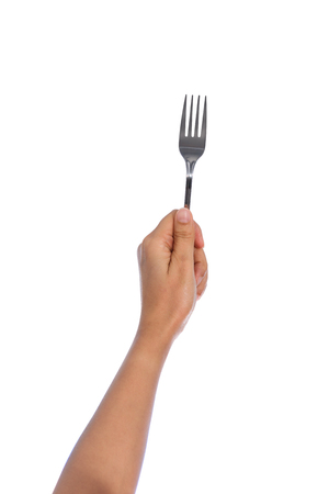 Woman hand holding a silver fork isolated on white  backgroundの写真素材