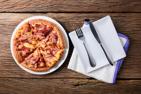 Delicious fresh pizza served on wooden table. view from topの写真素材