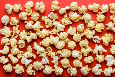 Popcorn on red background or textureの写真素材