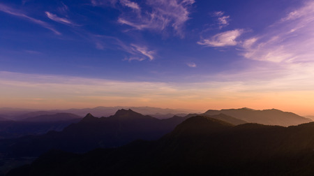 Sunset, View from phucheefa forest park mountain at Phucheefa,Chiangrai province ,North of Thailand. " THE PEAK OF MOUTAIN POINT TO THE SKY "の写真素材