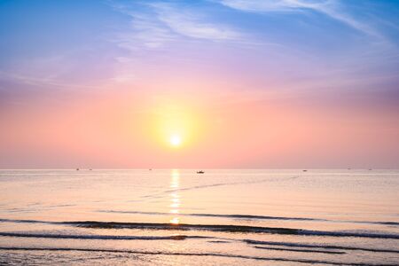 Beautiful tropical sunrise on the beach at Hua Hin, Prachuap Khiri Khan, Thailandの写真素材