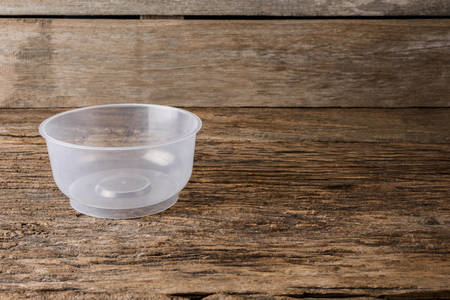 Empty containers for food on wooden table backgroundの写真素材