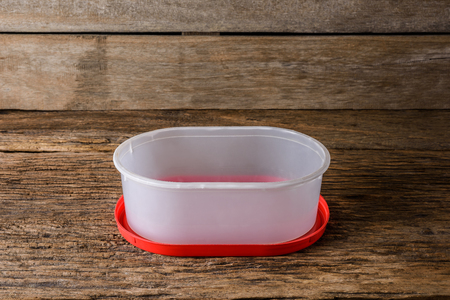 Empty containers for food on wooden table backgroundの写真素材