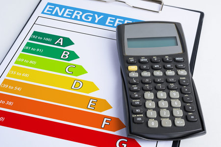 Energy efficiency concept with energy rating chart and calculator
