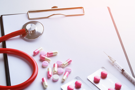 Blank Clipboard Drug in hospital or pharmacy. Cardiology heart treatment. Prescription Medical, medicine stethoscope and pills, syringe, injection on white background. Health care or illness.の写真素材