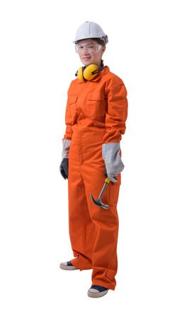 Full body portrait of a woman worker in Mechanic Jumpsuit with helmet earmuffs Protective gloves and Safety goggles is holding hammer isolated on white background clipping pathの写真素材