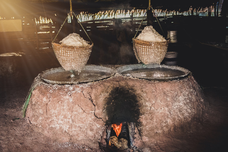 Ancient salt boiling, traditional rock salt making at Boklua District, Nan Province, Thailandの写真素材