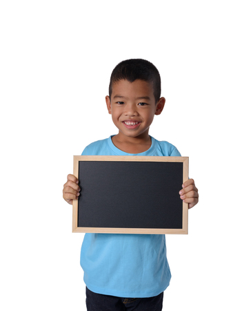 Asian Cute Country boy with blank black chalkboard  for education conceptual isolated on white background with clipping pathの写真素材