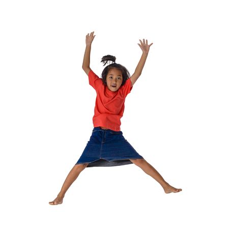 people concept happy little asian boy jumping in air happiness, childhood, freedom in movement isolated on white with clipping pathの写真素材