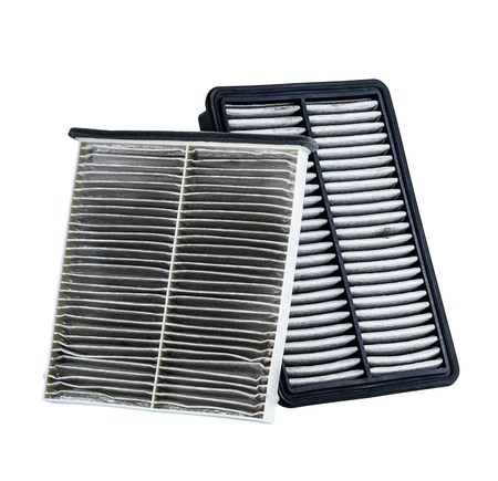 dirty air filter for car, automotive spare part in plastic case isolated on white background with clipping pathの写真素材