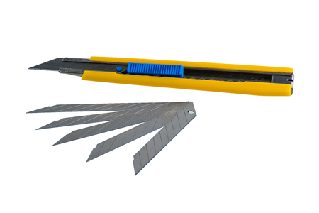 Yellow Box cutter, Paper cutter handle, stationery knife with scratches from use and Spare blade isolated on white background with clipping pathの写真素材