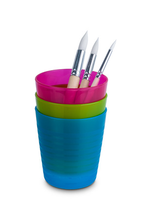 Group of Various sizes Water paint brush, wooden handle in colorful plastic glass isolated on white background with clipping pathの写真素材