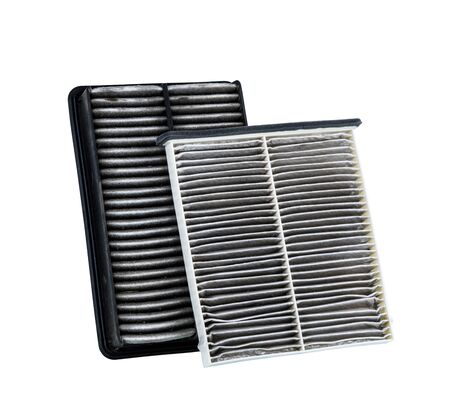 dirty air filter for car, automotive spare part in plastic case isolated on white background with clipping pathの写真素材