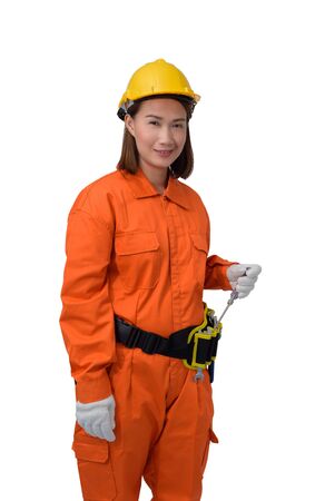 construction woman workers wearing Orange Protective clothes, helmet hand holding screwdriver with tool belt isolated on white background with clipping pathの写真素材