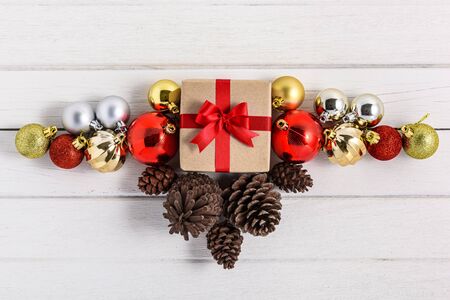 Gifts boxes with festive ribbons on white wooden background. holiday, giving, new year, christmas, birthday, celebration, anniversary with copy spaceの写真素材