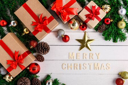 Christmas fir tree with decoration on white wooden board. Top view with copy space. Christmas or New year backgroundの写真素材