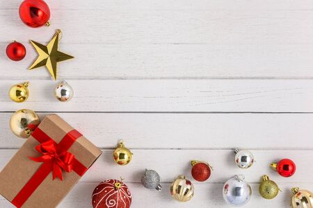 Gifts boxes with festive ribbons and christmas ornament on white wooden background. holiday, giving, new year, christmas, birthday, celebration, anniversary with copy spaceの写真素材