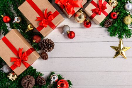 Christmas fir tree with decoration on white wooden board. Top view with copy spaceの写真素材