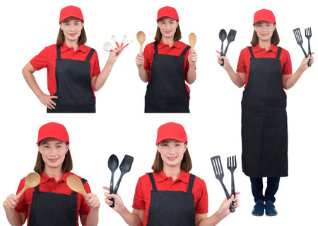 Collection set Portrait of young housekeeper smiling in red uniform with apron hand holding Plastic ladle set isolated on white backroundの写真素材