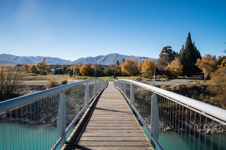 bridge cross green river in the day have blue sky.の写真素材