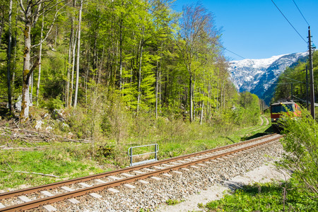 Railroad tracks have train on railroad. The narrow-gauge railway along the ridge in clear blue sky day on summerの写真素材