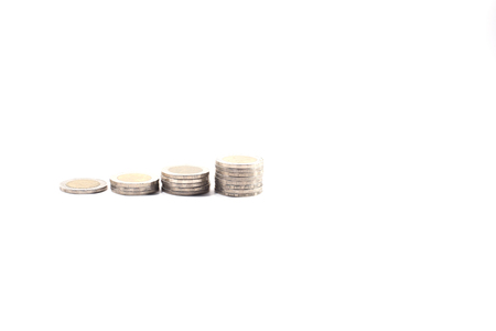 Money saving concept with sliver coin stack is growing concept with white background,space left sideの写真素材