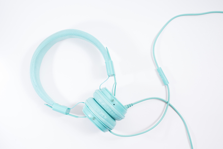 blue stylish earphone isolated over whiteの写真素材