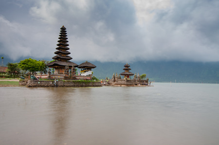 Pura Ulun Danu temple panorama at cloudy day essay on a lake Bratan, Bali, Indonesiaの写真素材
