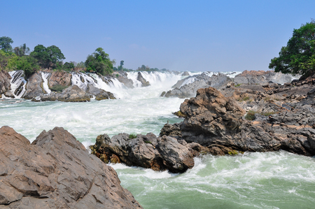 Big waterfall in Mekong river, Have a big rock and Water rapids.の写真素材