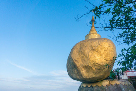 Golden rock, Kyaiktiyo pagoda with blue sky and moon background, Myanmar Burmaの写真素材