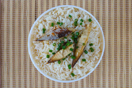 Fried rice with mackerel top view on mat backgroundの写真素材