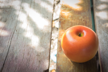 fresh apple on wood table imageの写真素材