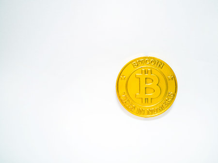 Golden coin with bitcoin symbol .Physical bit coin. Digital money. Cryptocurrency. on white background.の写真素材