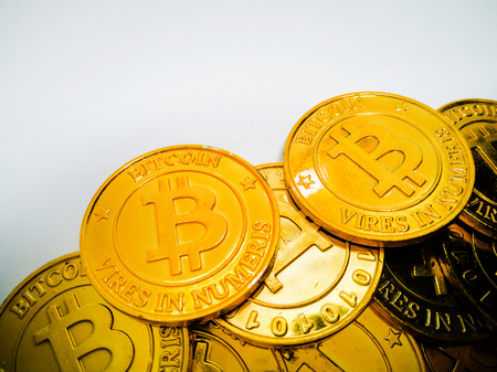 Golden coin with bitcoin symbol .Physical bit coin. Digital money. Cryptocurrency. on white background.の写真素材