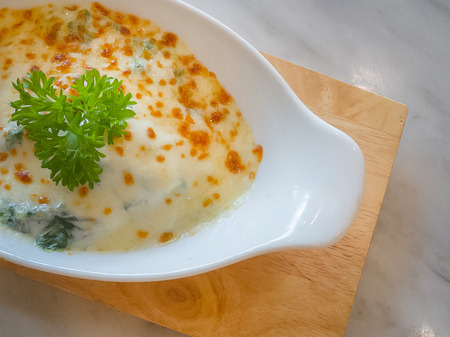 The Spinach with cheese in white bowl on wood plate  Flat Lay image.の写真素材