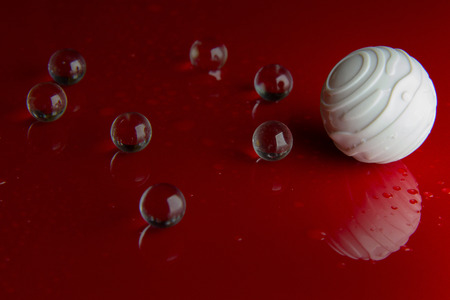 abstract  crystal ball on red glossy floor background.の写真素材