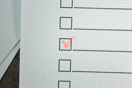 The red pen check point in black box on paper.