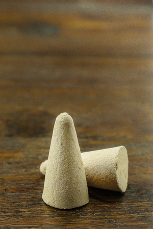 The Incense Cone in a stand with the feather for background.の写真素材
