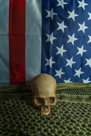 united states of America flag and Shemagh  and skull abstract background.の写真素材