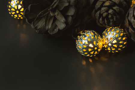 christmas ball and Pine cones  on black  background.の写真素材