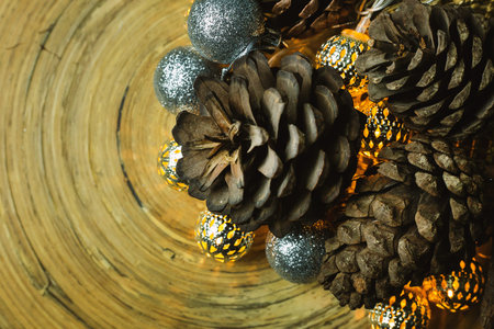 The christmas ball and Pine cones  on wood  background.