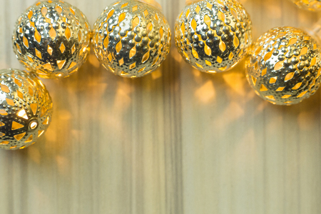 gold Christmas ball  on  white  wood  table background.の写真素材