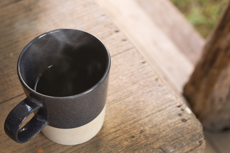 The morning coffee cup on wood table.の写真素材