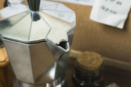 The vintage roaster coffee  on wood table.の写真素材