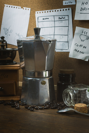 The vintage roaster coffee  on wood table.の写真素材