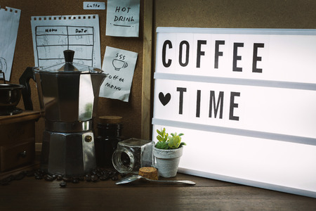 The vintage roaster coffee  on wood table.の写真素材
