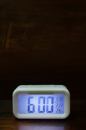 The digital alarm clock  6:00 close up image.の写真素材