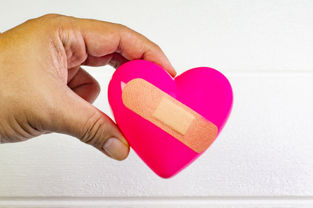 The pink Heart and hand for medical content.の写真素材