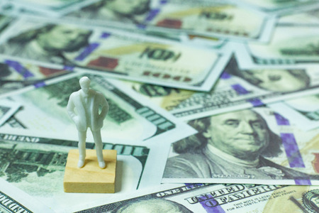 White  figure human and  100 dollar banknote  business content.の写真素材