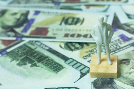 White  figure human and  100 dollar banknote  business content.の写真素材